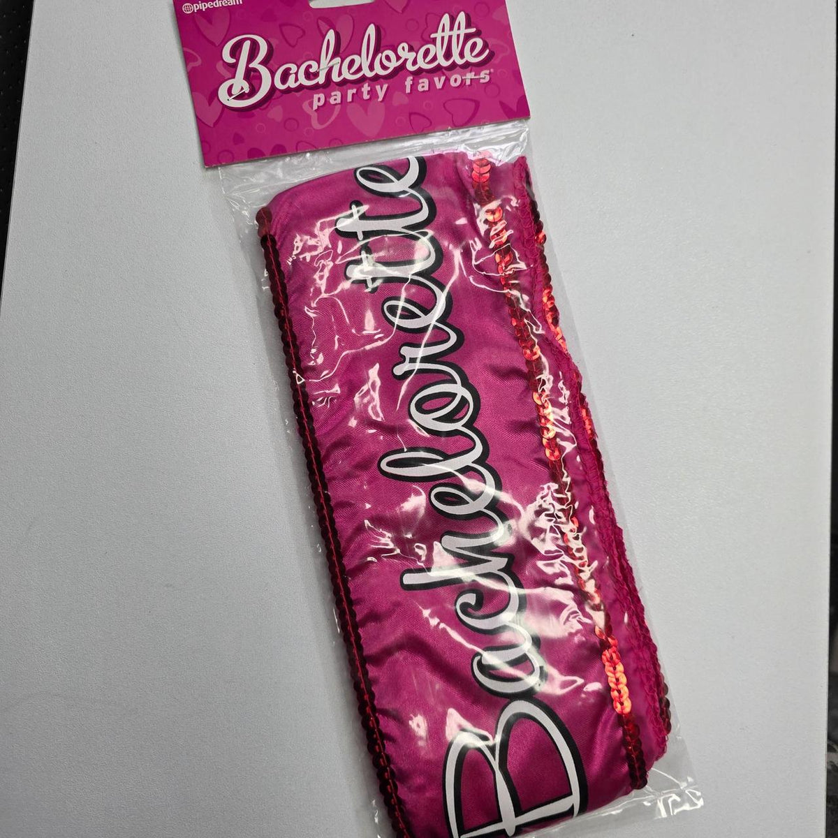 Pink bachelorette sash with white cursive text reading 'Bachelorette' with sparkles sequence - Image 3